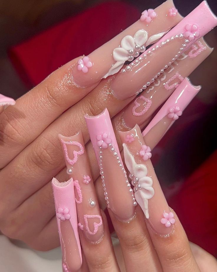 Chic Soft Pink Nail Design with 3D Embellishments and Pearl Accents