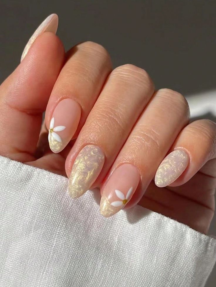 Chic Floral Nail Design with Translucent Base and Subtle Shimmer