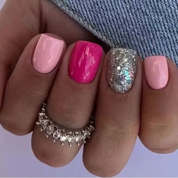 Chic and Playful Nail Design: Soft Pink Meets Vibrant Fuchsia with Glitter Accents.