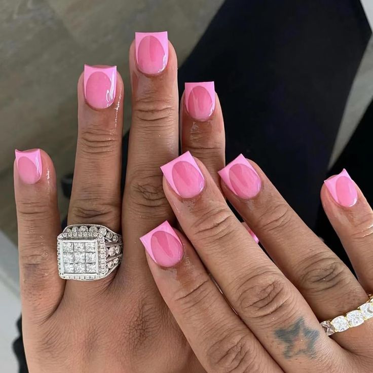 Chic Geometric Pink Nail Design with Glossy Finish and Elegant Rings.