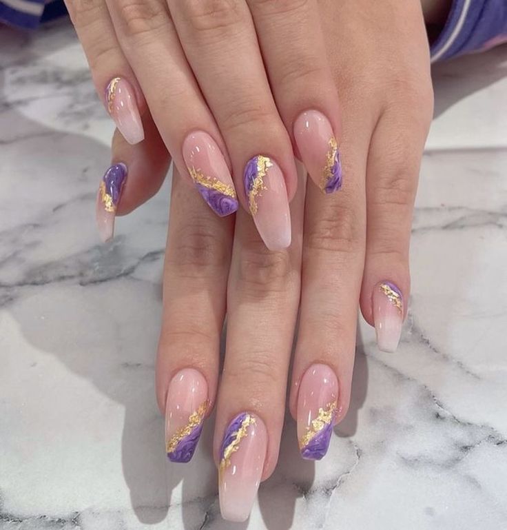 Modern Gradient Nail Design: Soft Nude and Vibrant Purple with Gold Accents.