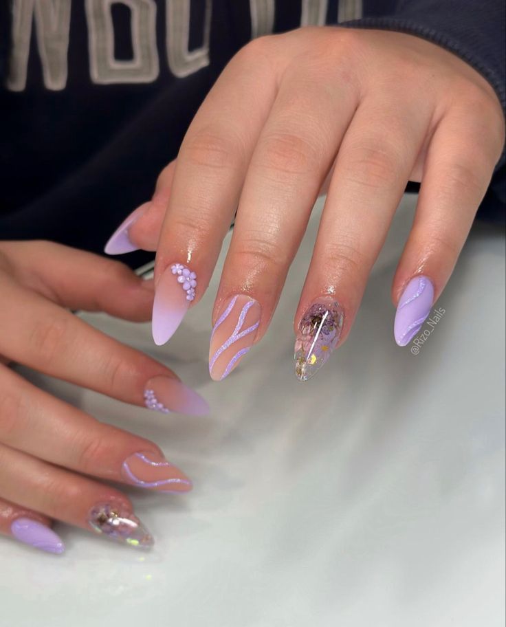 Elegant Lavender Nail Design with Matte and Glossy Finishes, Accented by Gems and Fluid Line Art.