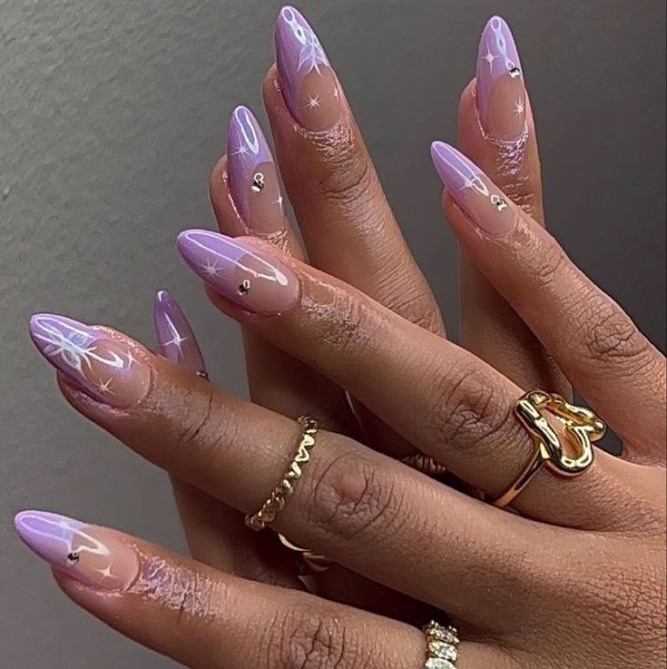 Dreamy Elegant Purple Stiletto Nails with Holographic Designs and Gemstone Accents