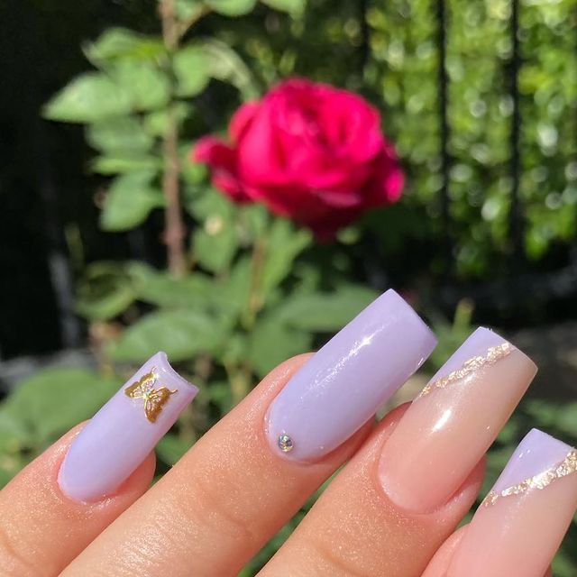 Elegant Lavender Nail Design with Matte and Glossy Finishes, Gold Foil Accents, and Gemstone Touch.