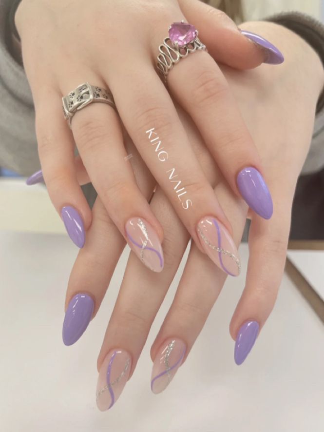 Chic Purple Almond Nail Design with Glossy, Matte Finishes and Elegant Silver Accents.