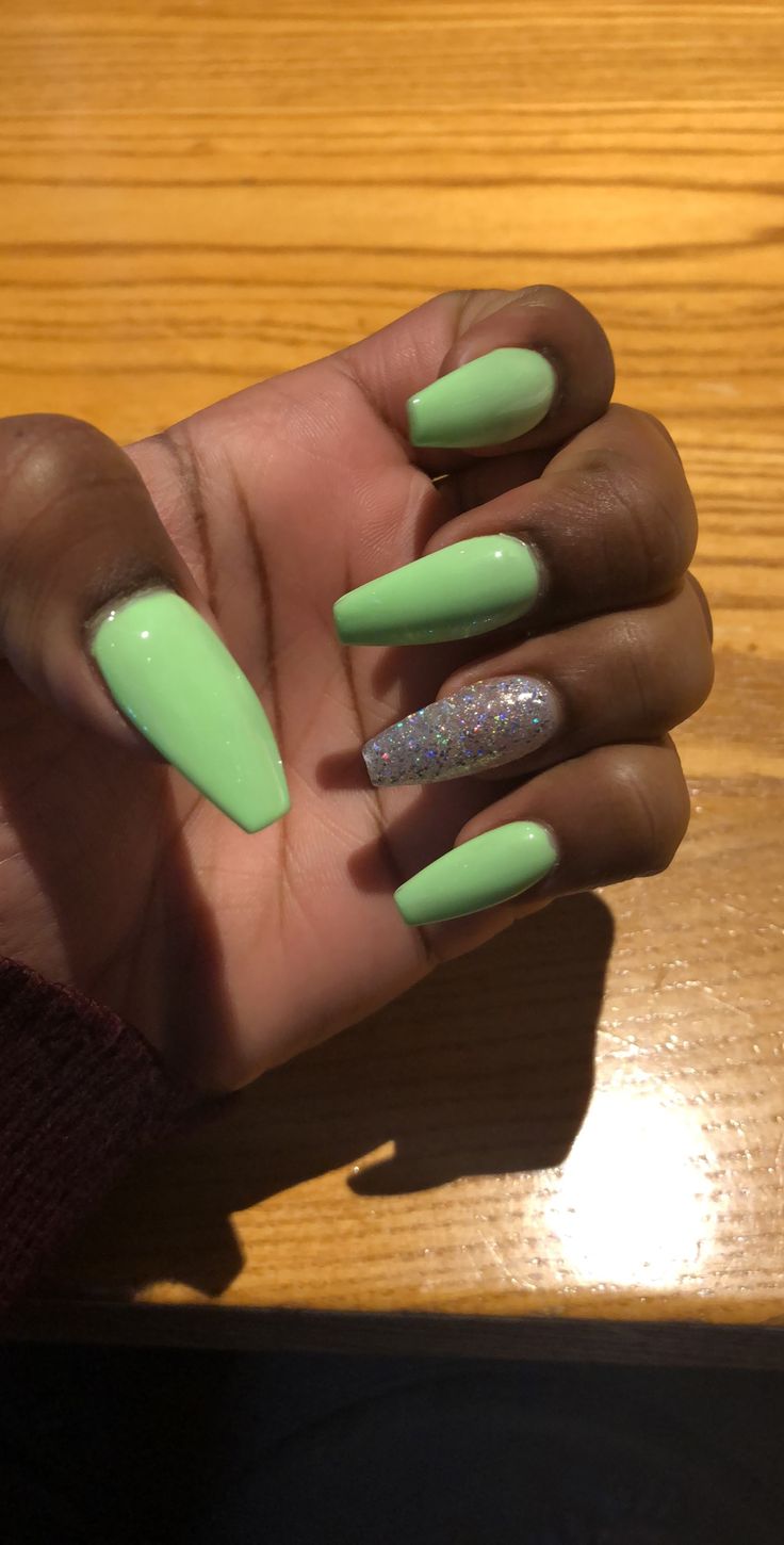 Trendy Mint Green Nail Design with Glamorous Glitter Accent