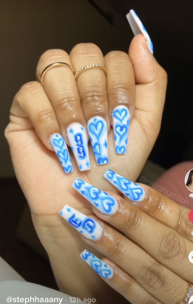 Playful Blue Heart Nail Design on Elegant White Background.