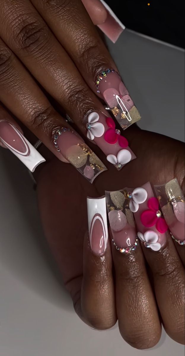 Elegant Floral-Inspired Nail Design with Soft Pinks, Whites, and Gold Accents