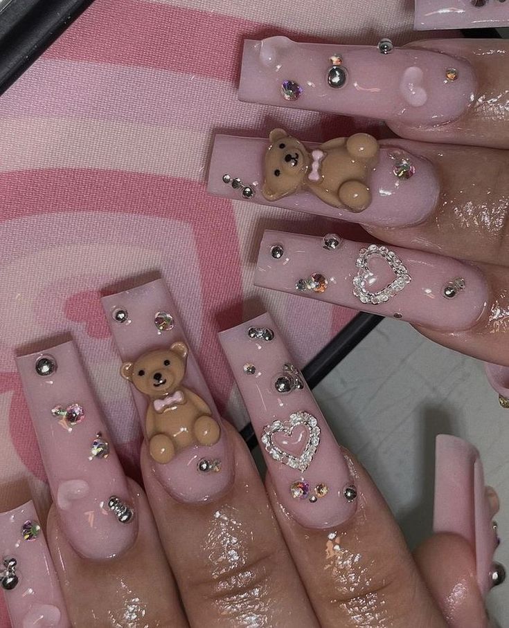 Charming Bear-Themed Pink Nail Art with Rhinestones and Hearts.