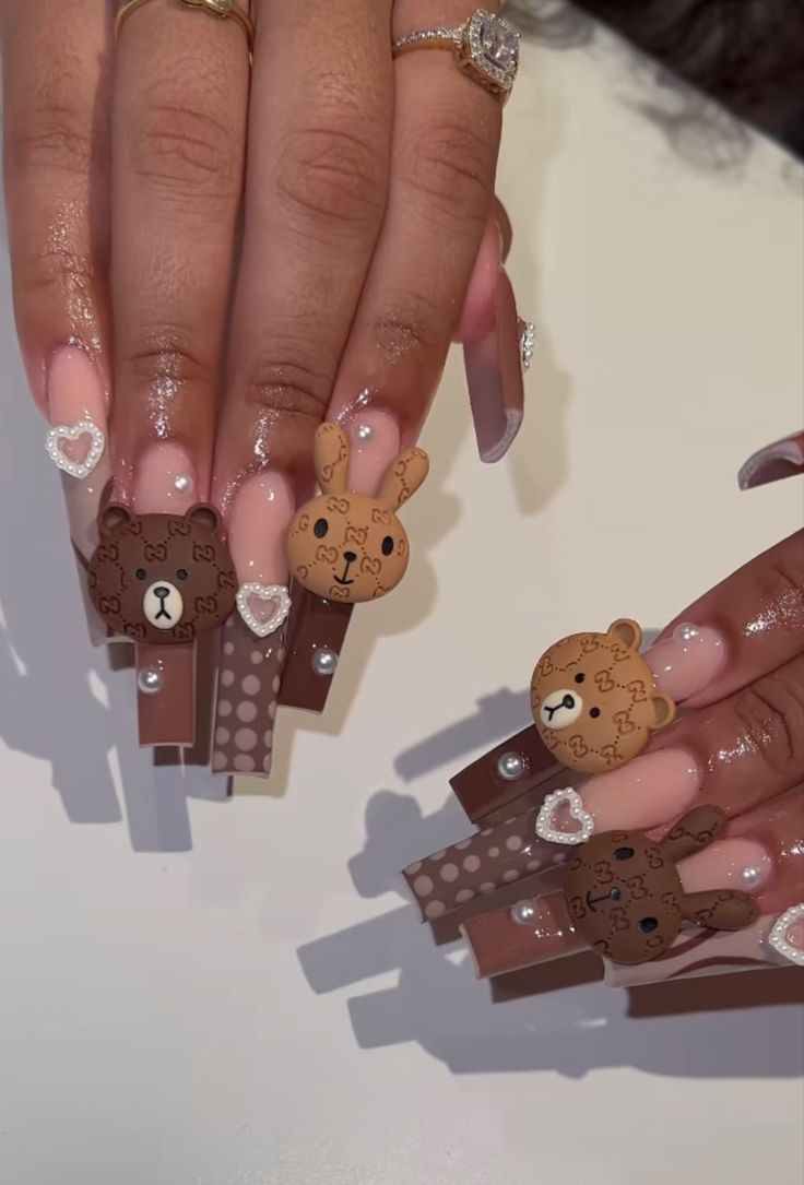 Whimsical Teddy Bear and Bunny Nail Art with Playful Patterns and Gem Accents.