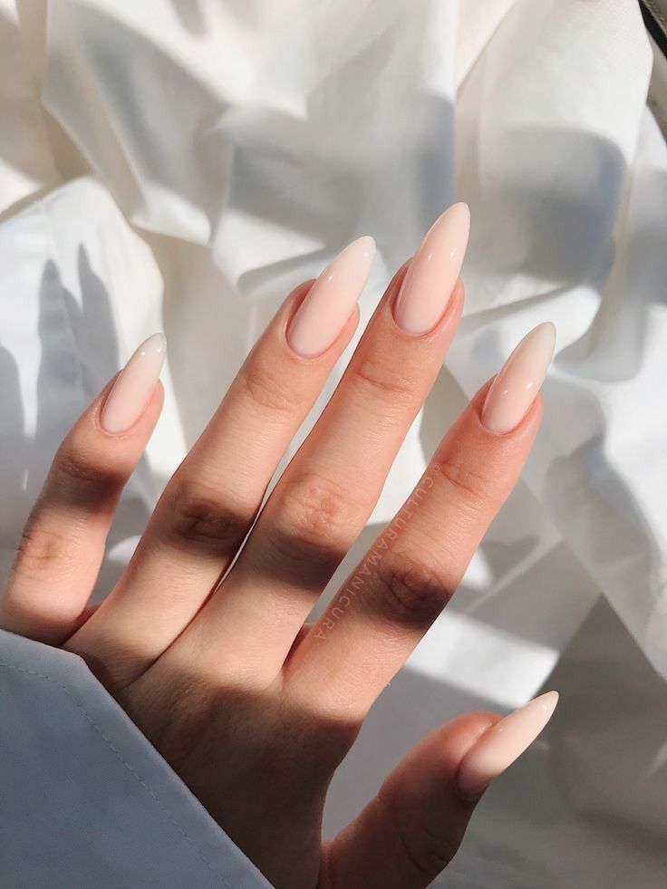 Chic Almond-Shaped Nails in Soft Nude: Elegance for Any Occasion.