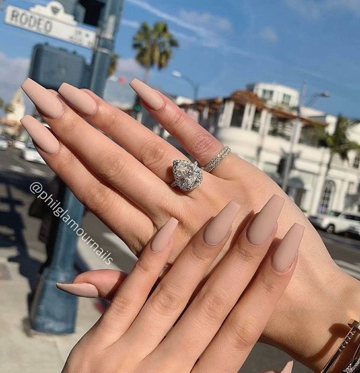 Elegant Long Almond Nude Nails with Matte Finish for a Chic Aesthetic