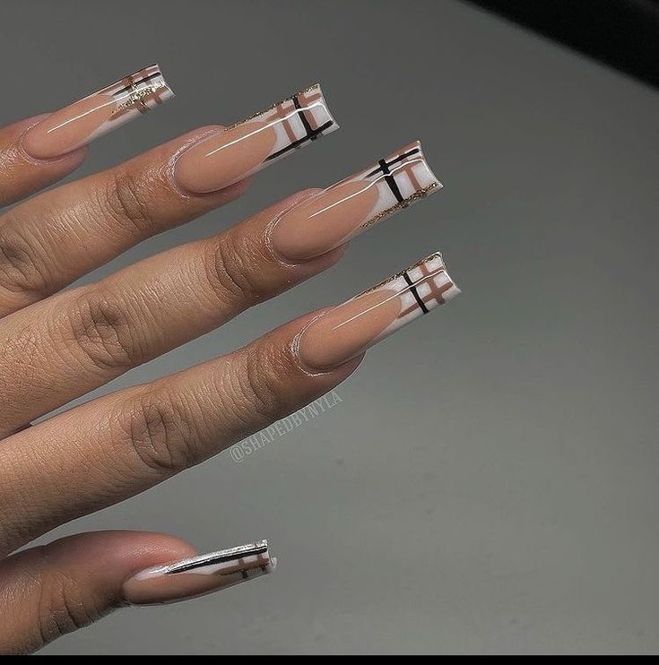 Chic Nude Long Nails with Geometric Designs and Metallic Accents