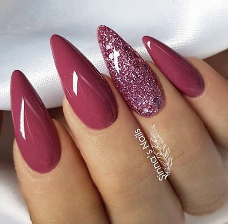 Sophisticated Berry-Toned Almond Nails with Glamorous Glitter Accent.