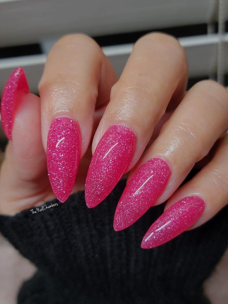 Dazzling Pink Stiletto Nails: A Bold and Sophisticated Statement.