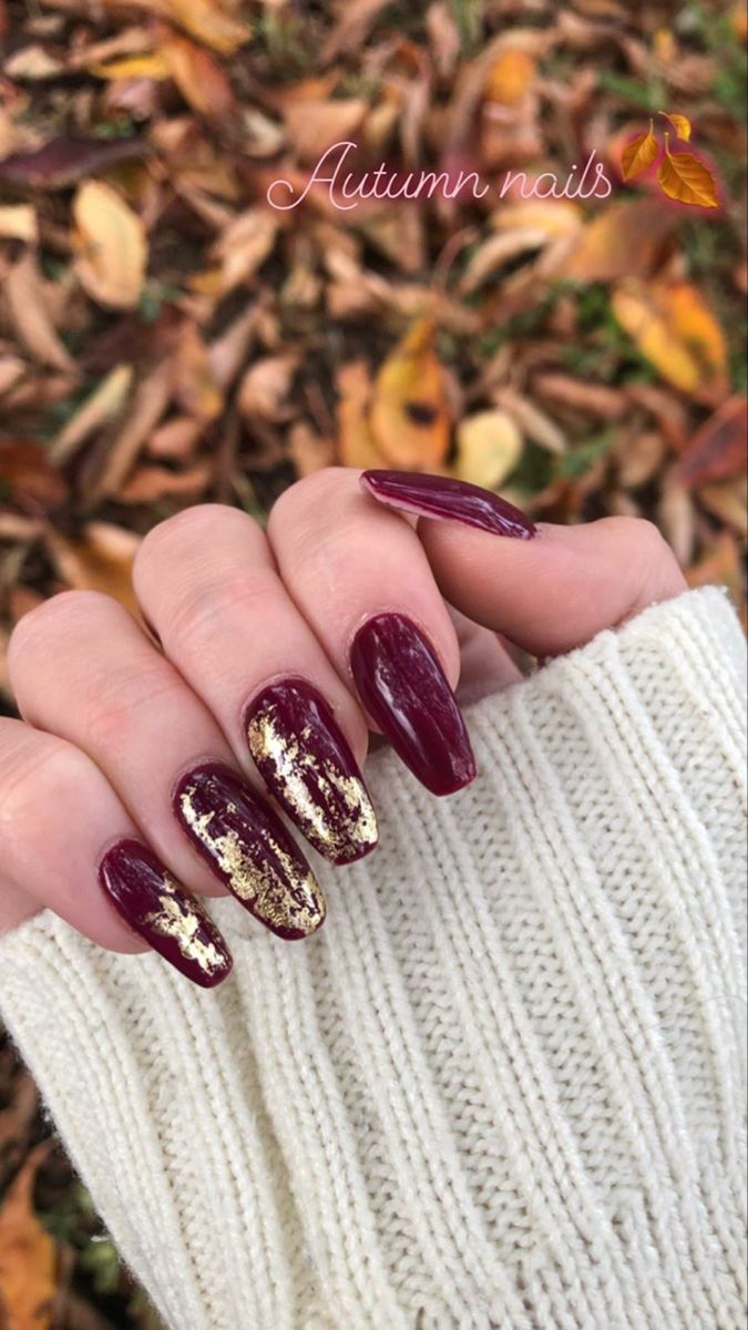 Chic Autumn Nail Design: Deep Burgundy with Gold Foil Accents and Glossy Finish