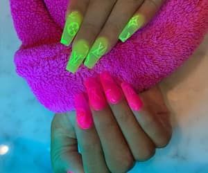 Bold Neon Nails: A Striking Fashion Statement with Playful Designs for Any Occasion.