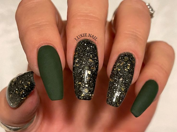 Striking Matte Green Nail Design with Glittery Black Accents for Bold Elegance.