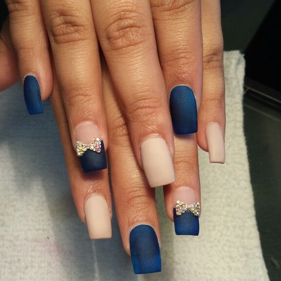 Chic Matte Navy and Beige Nail Design with Rhinestone Bows