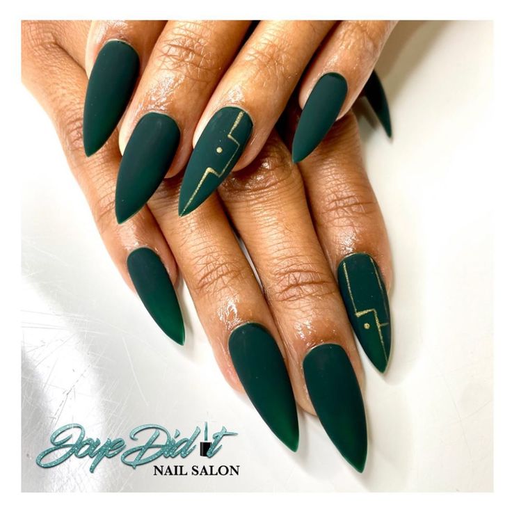 Elegant Matte Emerald Green Almond Nails with Geometric Designs and Subtle Gold Accents.