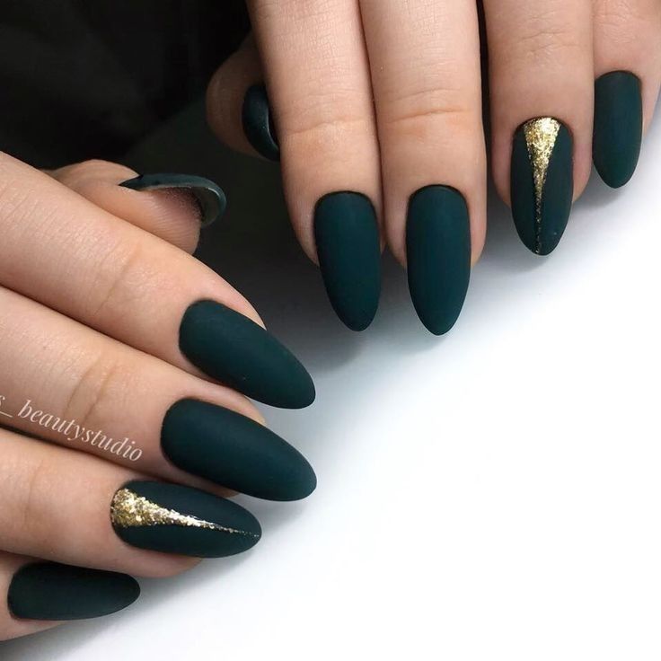 Sophisticated Dark Green Matte Nails with Glamorous Gold Accents.