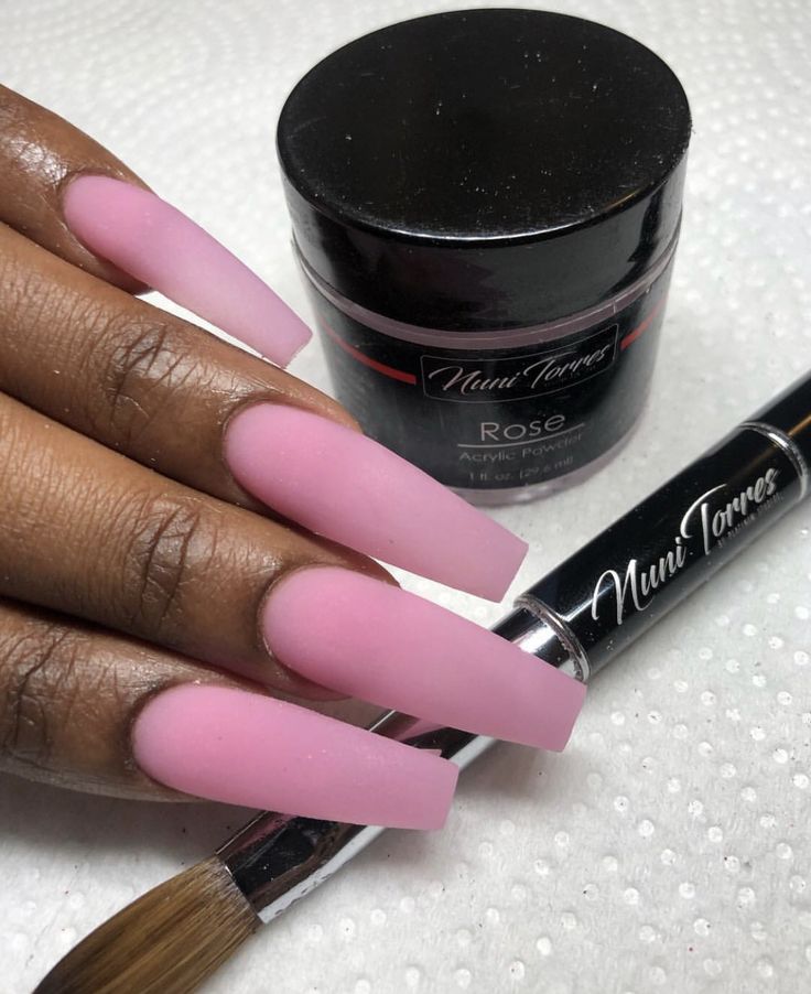 Elegant Soft Pink Matte Long Acrylic Nails with Nail Care Tools for Chic Aesthetic.