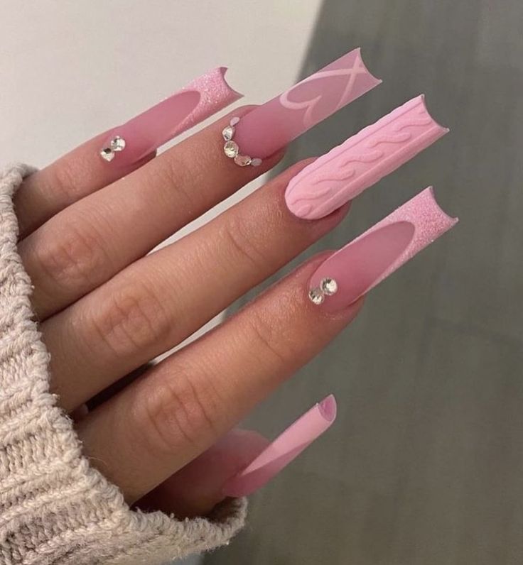 Elegant Pink Nails: A Stylish Blend of Textures, Patterns, and Glamour.