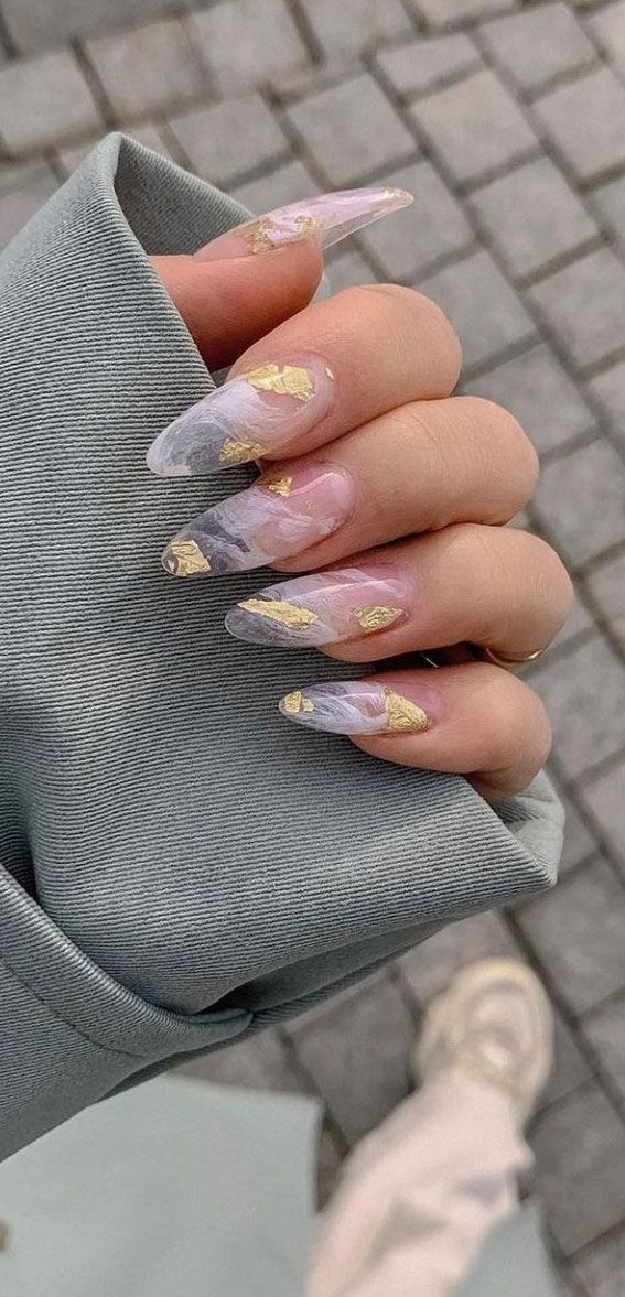 Chic Translucent and Marble Nail Design with Gradient Pink to Gray and Gold Accents.