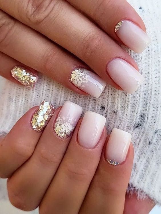 Sophisticated Elegant Nail Design: Soft White and Nude Gradient with Glitter and Sequin Accents