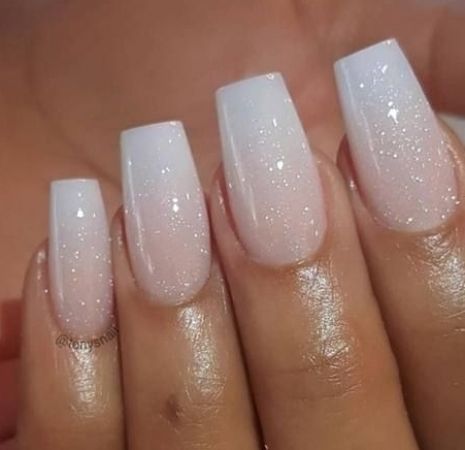 Chic Ombre Nails: White to Pink Gradient with Sparkling Glitter and Squared Tips.