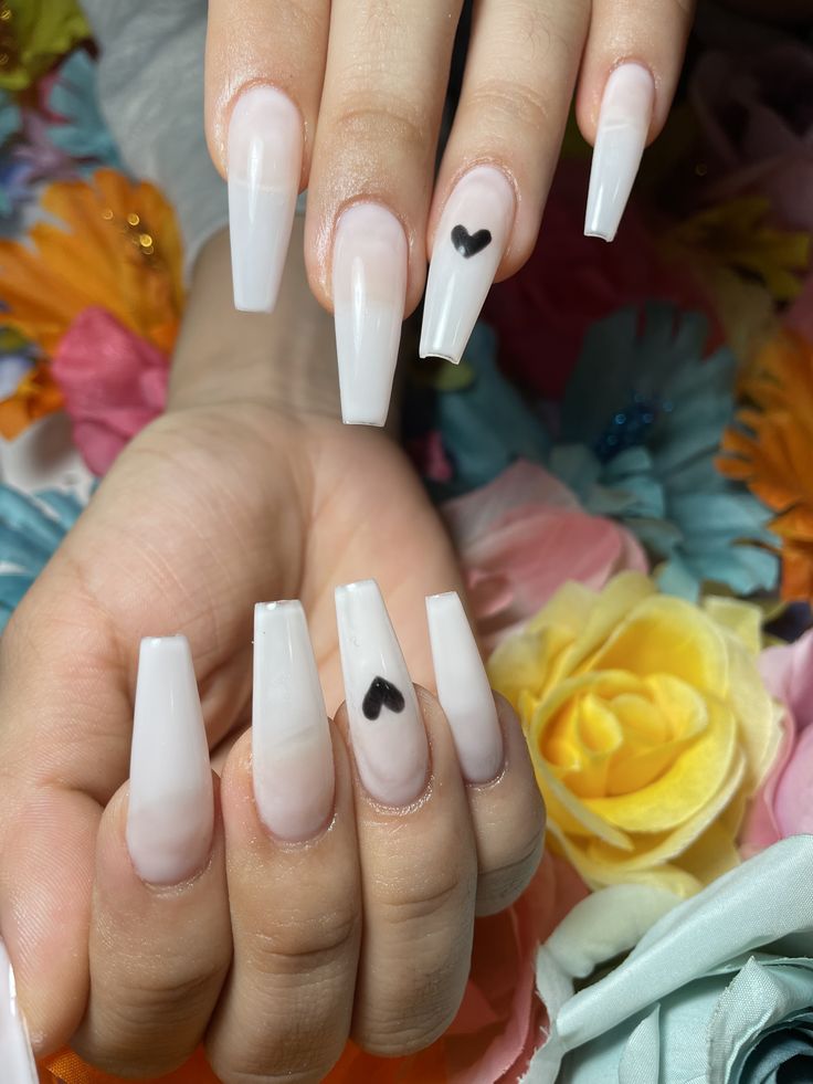 Chic Ombre Acrylic Nails with Minimalist Heart Design Surrounded by Vibrant Flowers