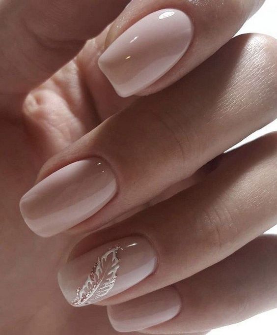 Sophisticated Nude Nails with Delicate Silver Feather Design for Effortless Chic Aesthetic.