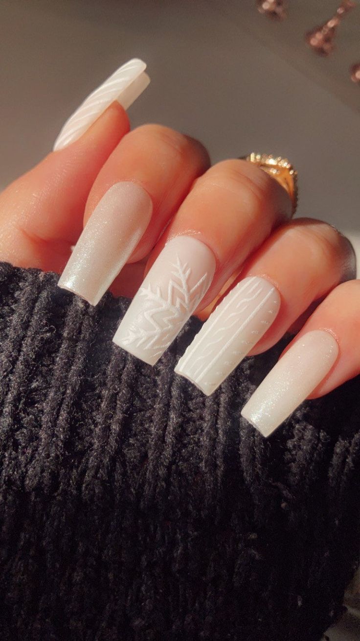 Elegant Frosted White Nail Design with Matte and Glossy Finishes and Winter Patterns