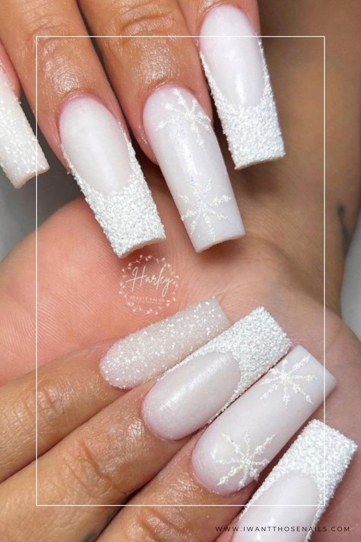 Elegant Winter Nail Design with Textured White Elongated Squares and Delicate Snowflake Patterns