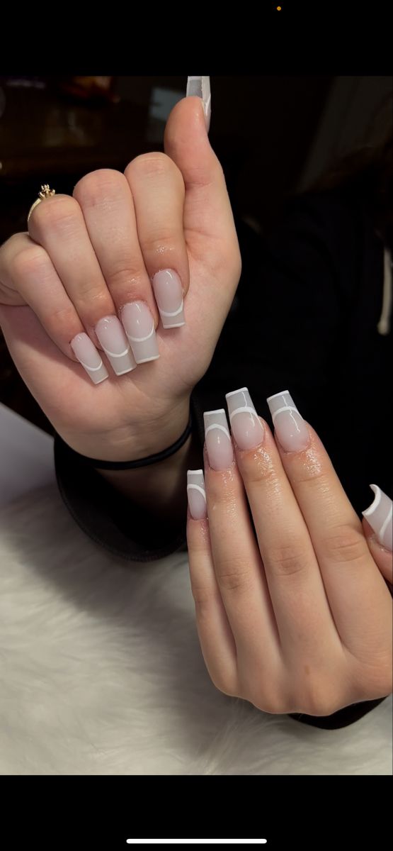 Chic Ombre Nail Design with Pale Pink and Crisp White Tips