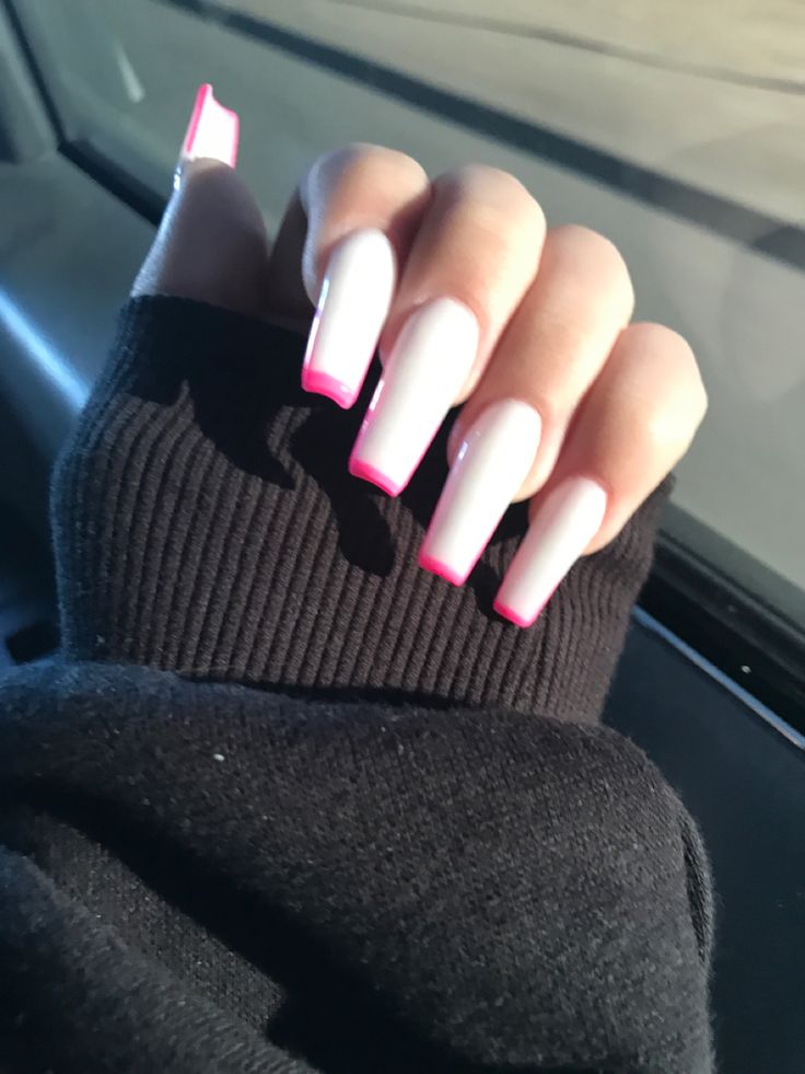 Stylish Long Glossy Acrylic Nails with Soft Pink Base and Bold Neon Pink Tips.