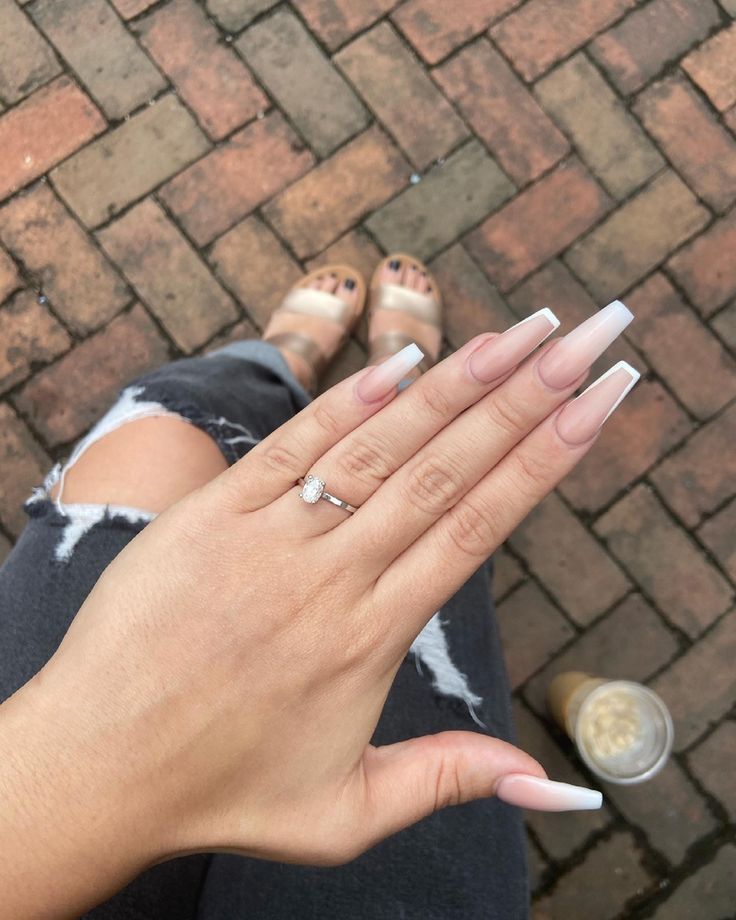 Chic Ombre Long Nails Paired with Elegant Accessories and Casual Attire.