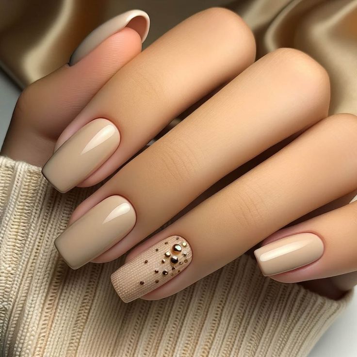 Sophisticated Elegant Nude Nail Design with Textured Finishes and Shimmer Accent.