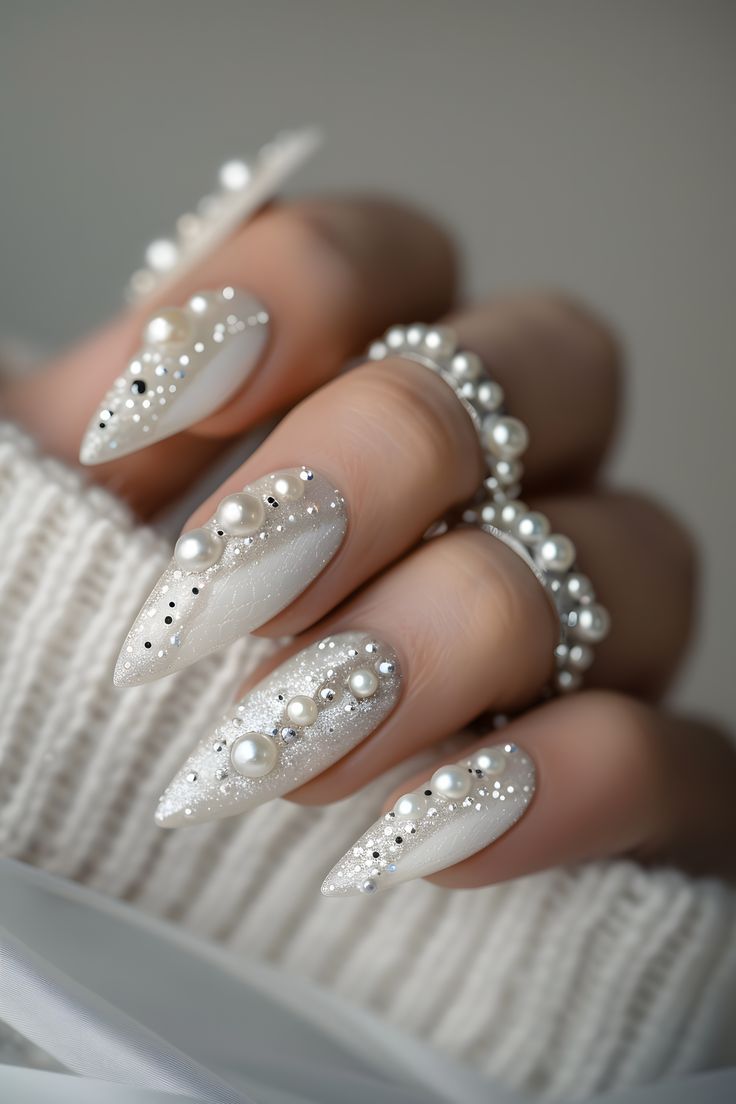 Sophisticated White and Silver Nail Design with Pearls and Sparkling Accents.