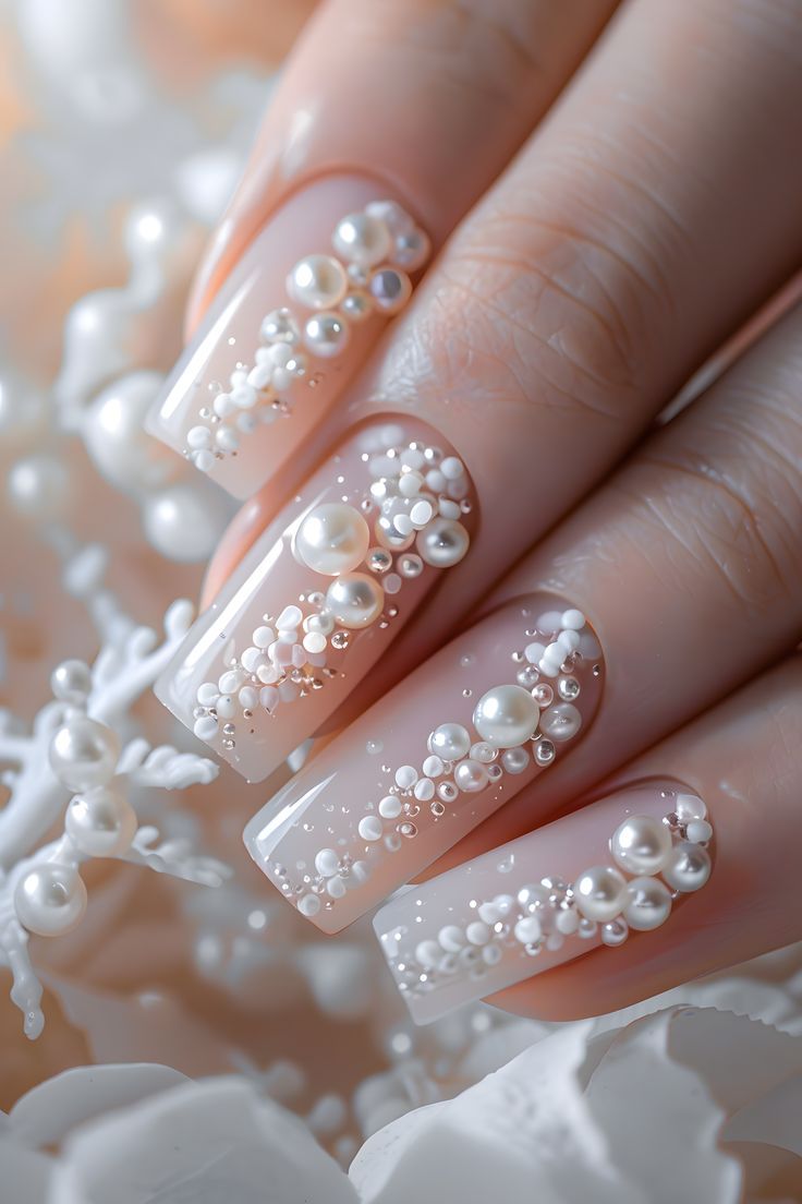 Sophisticated Nude Nail Design Adorned with Intricate Pearl Embellishments for Glamorous Occasions