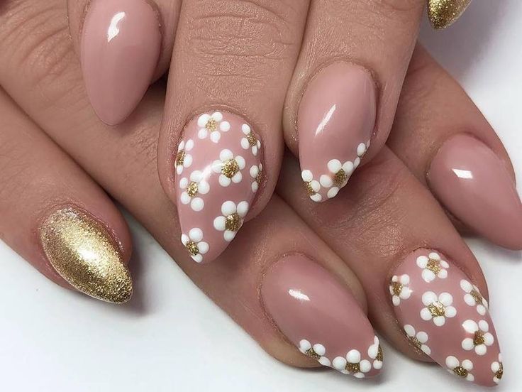 Chic Dual-Tone Nail Design: Soft Pink and Delicate White Flowers with Sparkling Gold Accent.