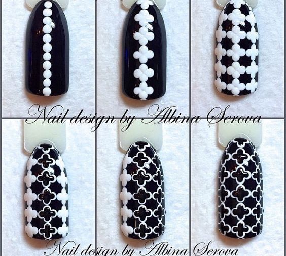 Bold Black and White Geometric Nail Designs Showcase Intricate Patterns and Unique Style.