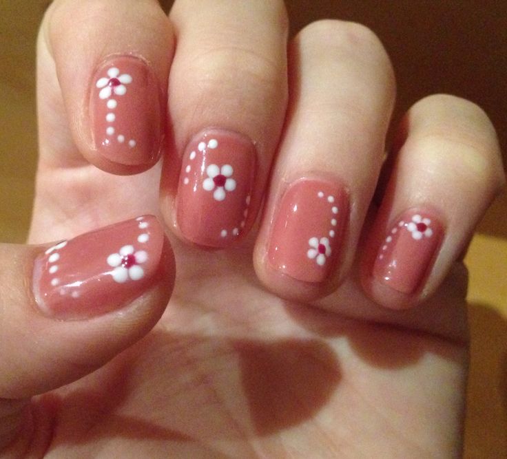 Delicate Peach Floral Nail Design: Whimsical Elegance for Spring and Summer.