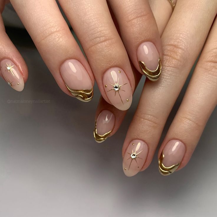 Chic Elegant Nude Nail Design with Golden Accents and Star Embellishments