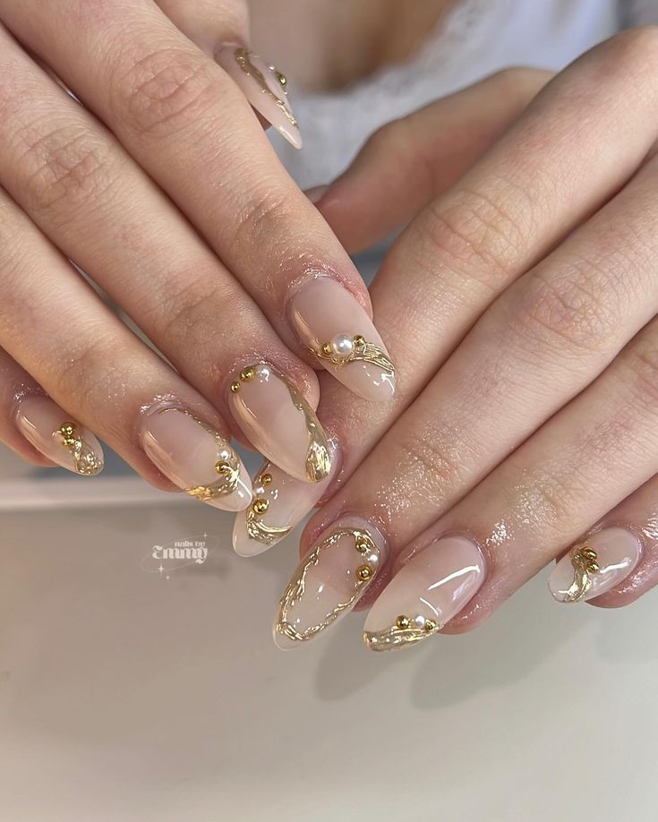 Sophisticated Elegant Nude Nails with Delicate Gold Accents and Pearls