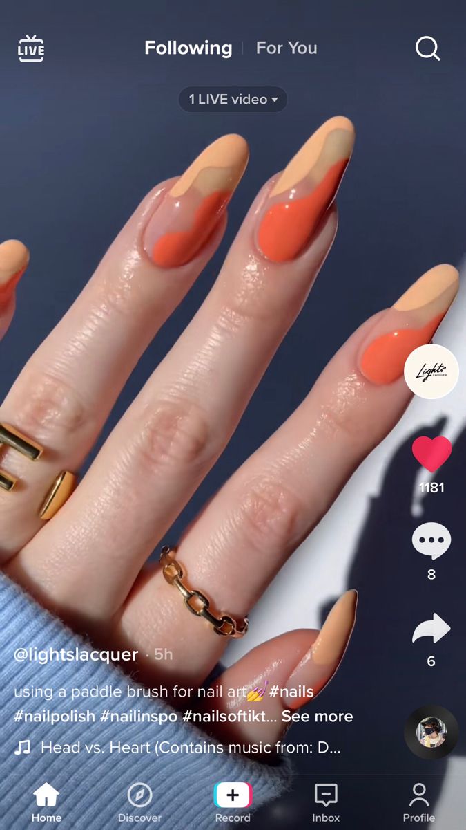 Trendy Almond-Shaped Nails with Modern Wave Design in Peach, Terracotta, and Nude Hues.