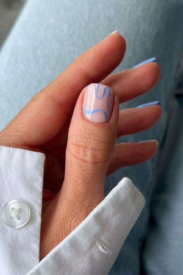 Chic Minimalist Nail Design: Nude Base with Fluid Blue Lines