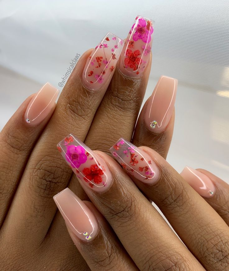 Floral-Inspired Nail Design with Sheer Pink and Nude Shades, Featuring Dried Flowers and Subtle Sparkle.