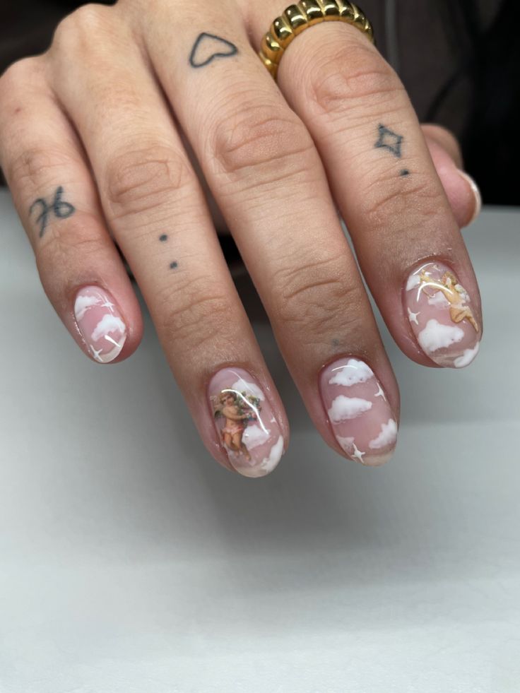 Dreamy Pastel Cloud Motif Nail Design with Ethereal Cherub Accents