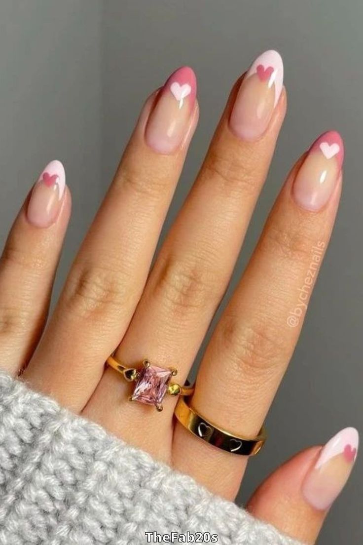 Elegant Soft Pink Nail Design with Delicate White Tips and Heart Accents.